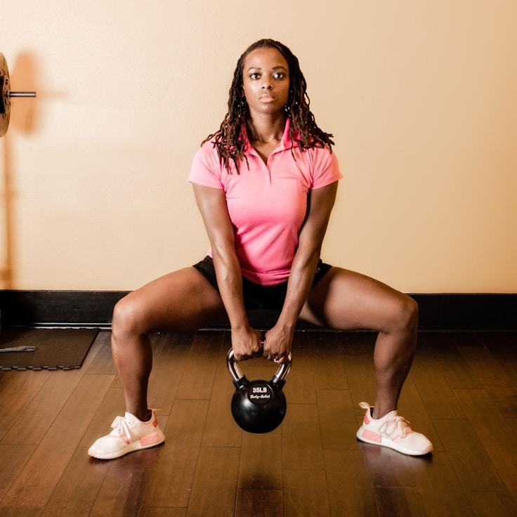 Women in a fitness class doing stretching and mobility exercises
